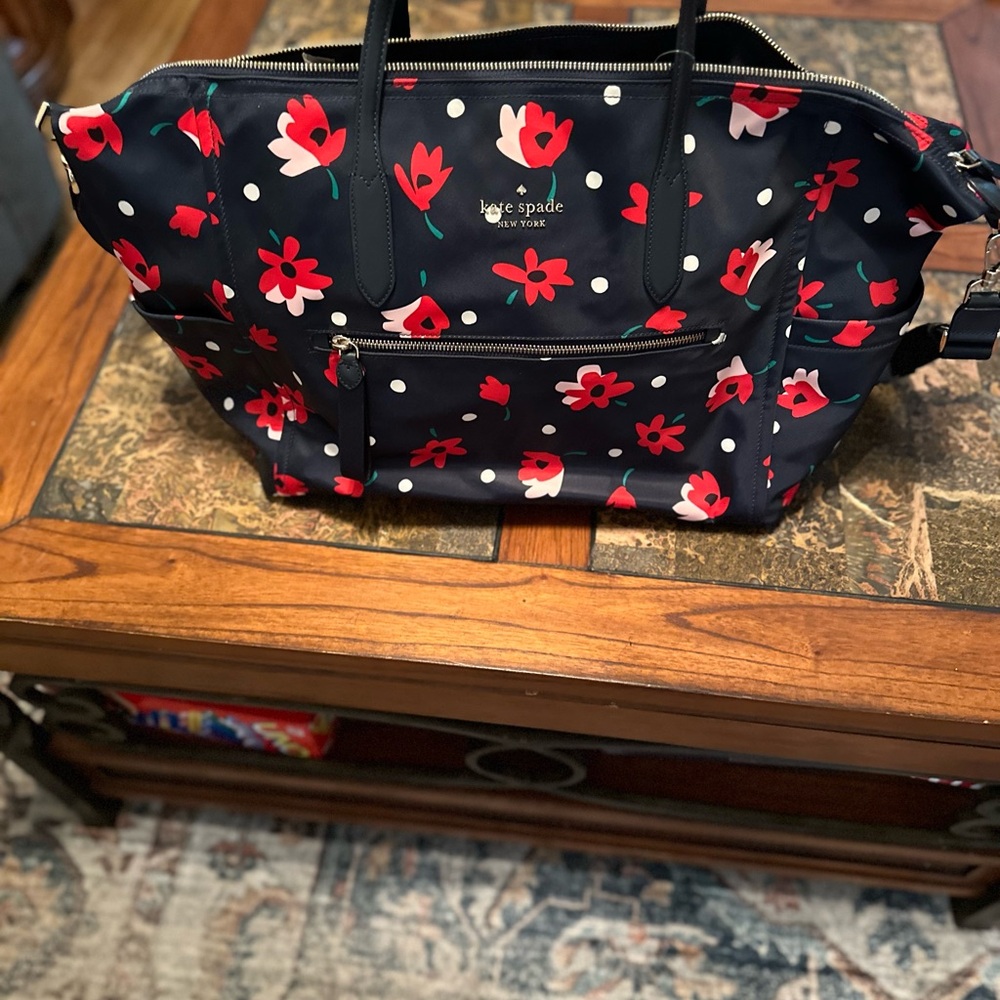 Kate Spade travel bag. Navy & red flowers. Approx 22 X 14 inches.